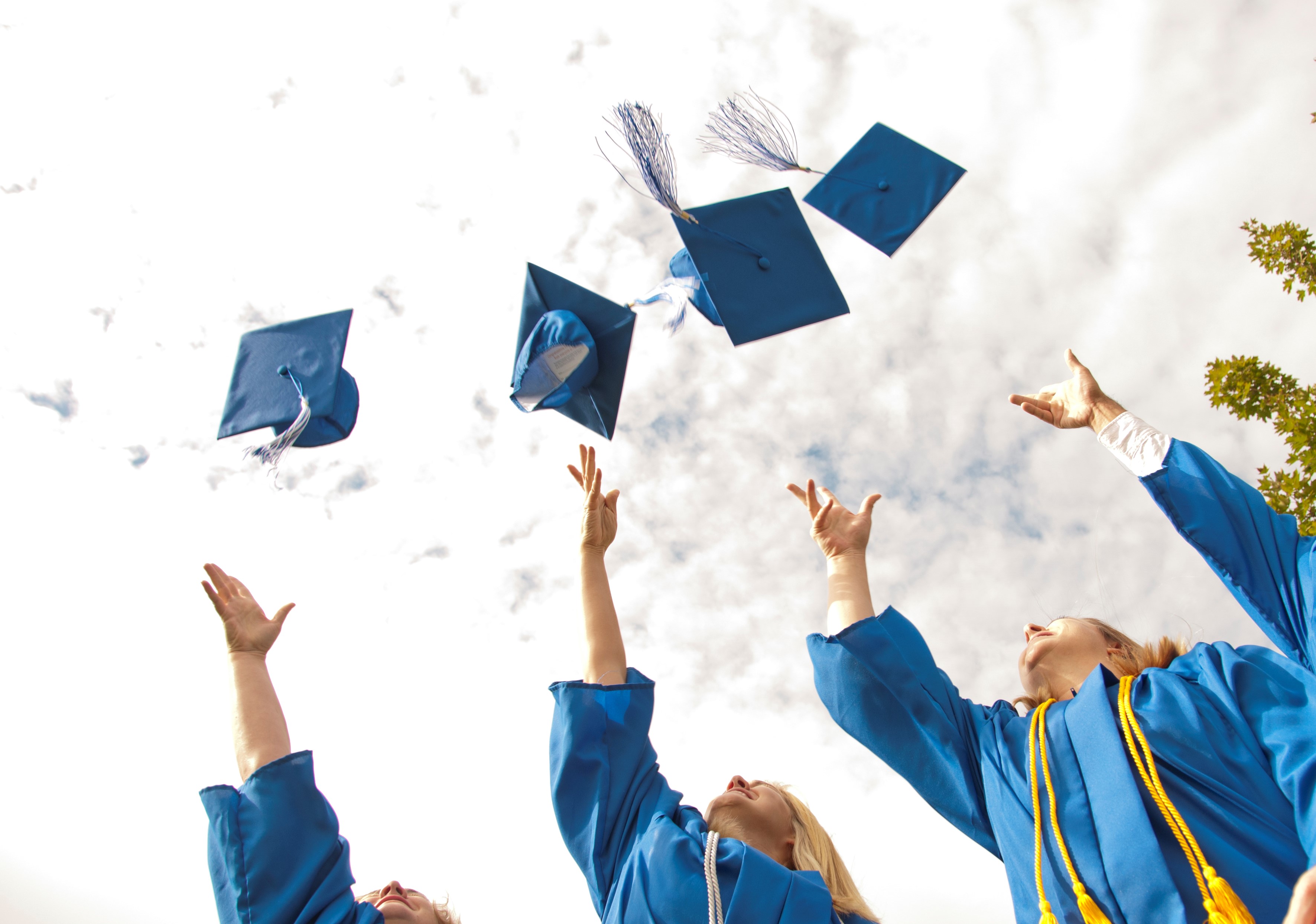Graduates throwing caps